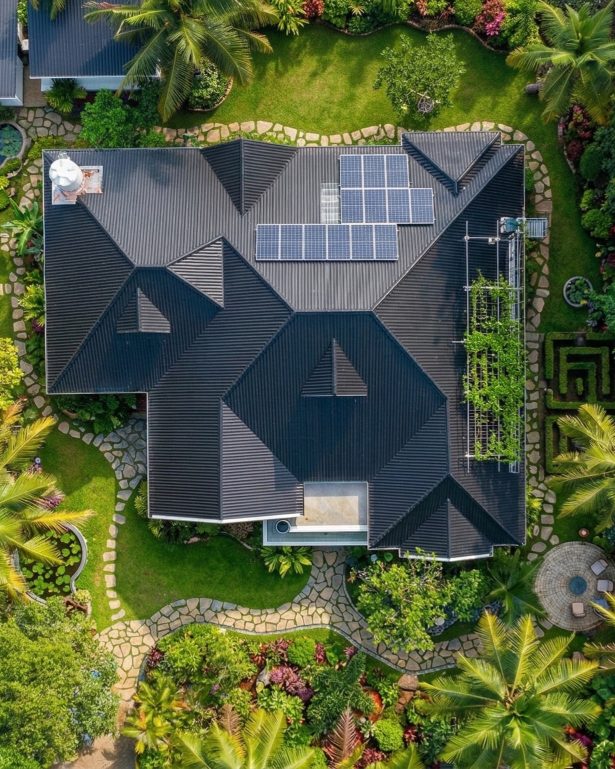 House that built by blue ceramic roof tile in Kerala